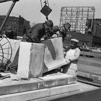 	 Rochester Public Library, Rundel Memorial Building, construction workers laboring on new balustrade