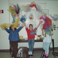 Teens dramatically tossing dancing scarves up in the air during a Teens and Tots program in 1991.