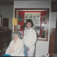 two librarians smiling