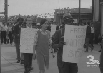 Still from newsreel of Congress of Racial Equality protest in front of Niagara Mohawk building (May 6, 1965 6PM WSYR Broadcast)