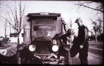 Charles Benson, mail carrier, with dog Pete