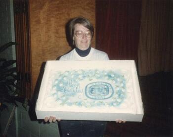 Cake being presented at the 100th anniversary.