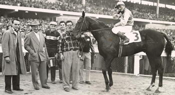John S. Phipps with one of his winning horses (second from left) at the Providence Autumn Handicap in Rhode Island, November 18, 1953.
