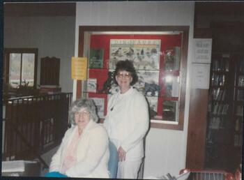 two librarians smiling