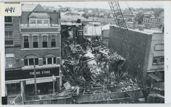 A building torn down between other buildings