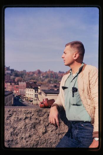 Photo of Gene Dauner looking at Rondout from the roof of the Cornell Building