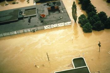 Aerial view of The Corning Museum of Glass surrounded by flood waters from 1972 hurricane Agnes.