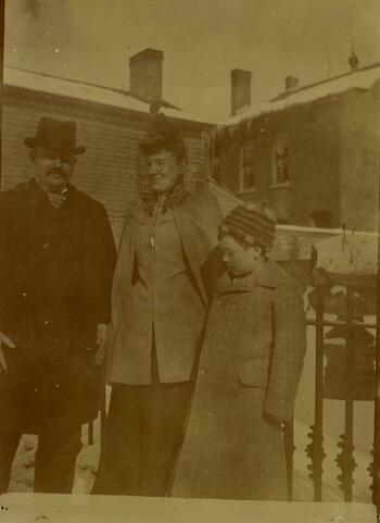Photograph of a man, woman, and child