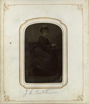 Photograph of a young woman in a dress