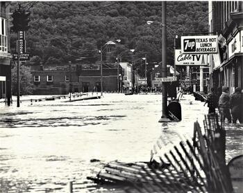 North side of Main Street before the bridge.
