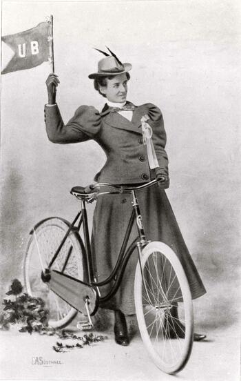University at Buffalo student with bicycle and flag, Iris Yearbook, 1898