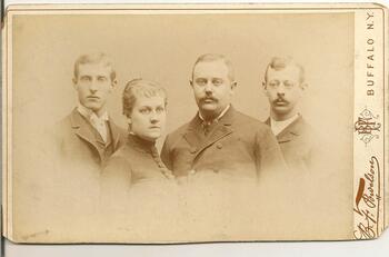 Image of three men and a woman, shoulders up