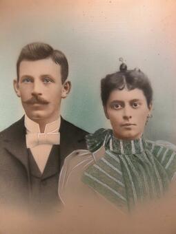 Color portrait photograph of couple in dressy clothing